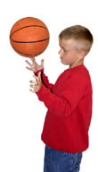 Boy spinning ball on fingers